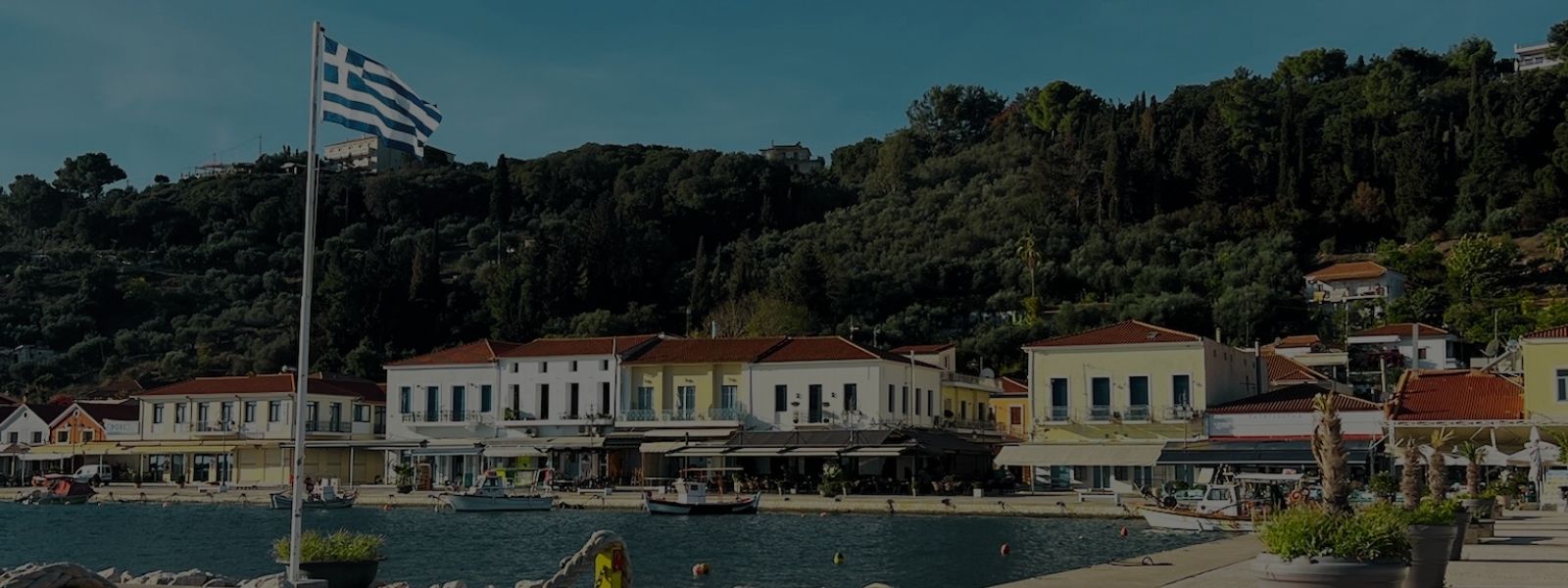 Greek flag at Pyrgos harbor – the home of Crazy Pharmacist olive oil